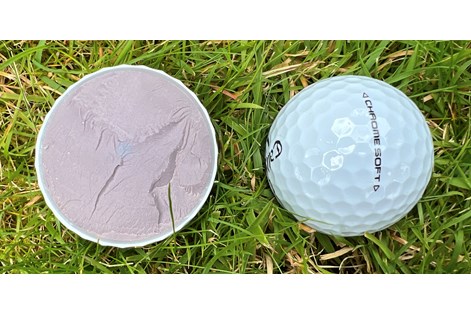 A Callaway Chrome Soft golf ball cut in half to show the layers inside