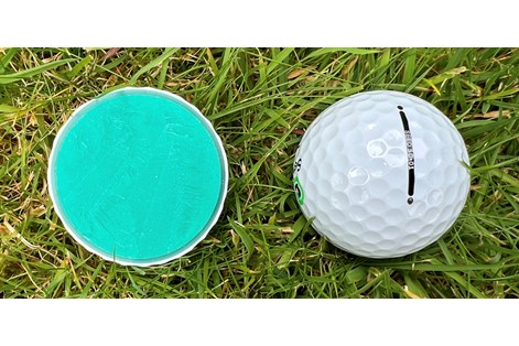 A Seed SD-01 golf ball cut in half to show the layers inside