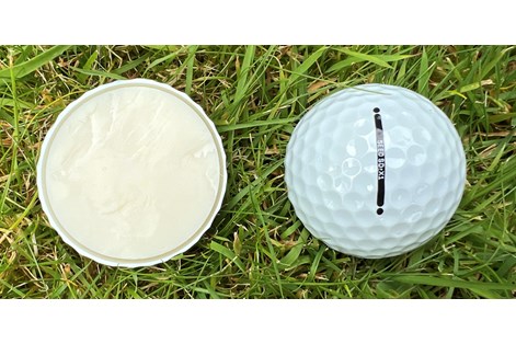 A Seed SD X1 golf ball cut in half to show the layers inside