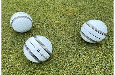 The TaylorMade TP5 and TP5x Stripe golf balls on a green.