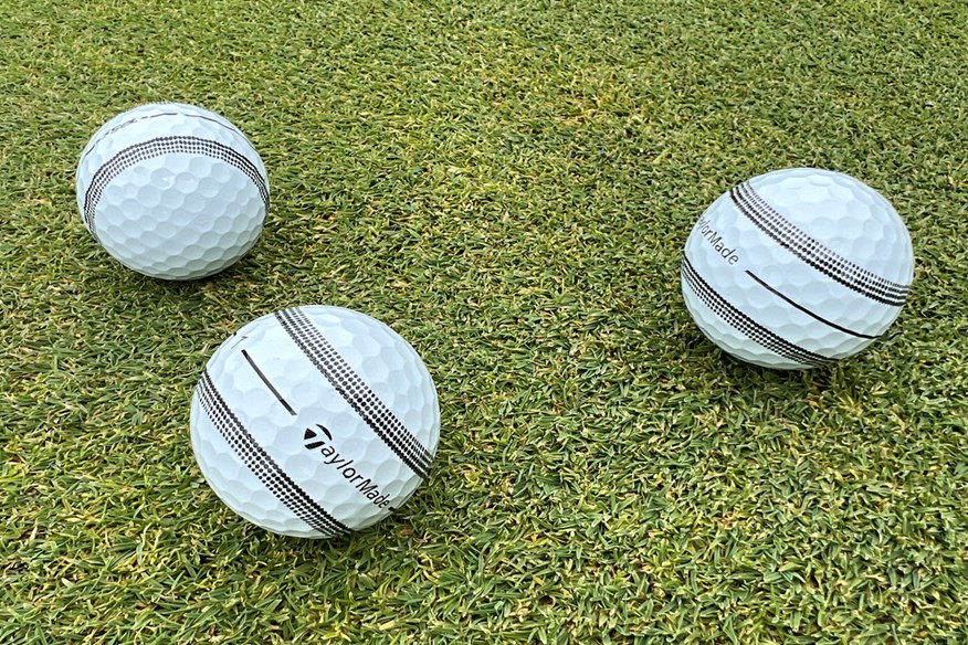 The TaylorMade TP5 and TP5x Stripe golf balls on a green.