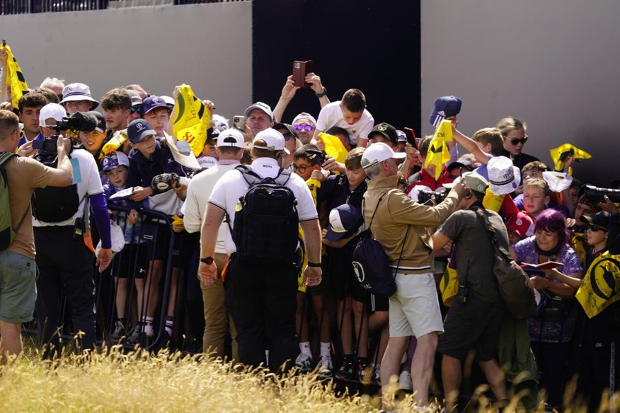 Kids collection autographs at the side of the 18th green at Royal Troon