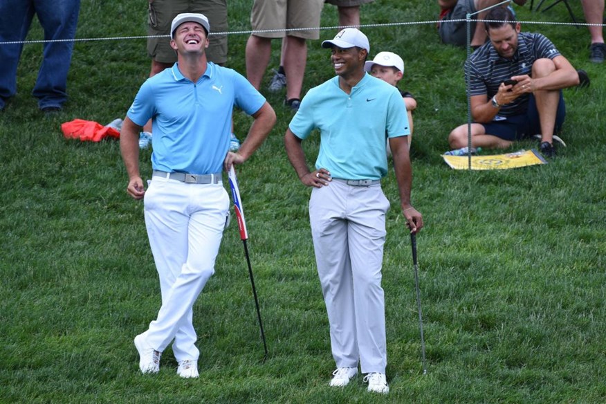 Bryson DeChambeau and Tiger Woods laughing together