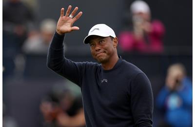 Tiger Woods acknowledges the crowd on the 18th hole at Royal Troon after missing the cut.