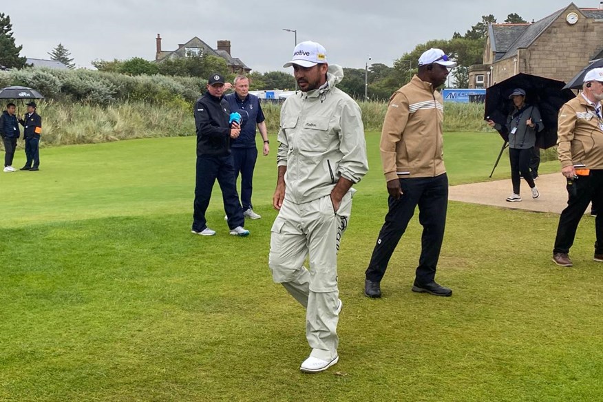 Jason Day sporting Malbon waterproofs