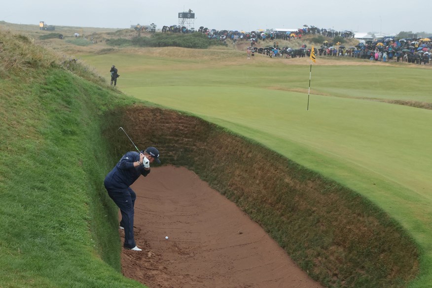 Shane Lowry had to play sideways out of the Postage Stamp's Coffin Bunker.