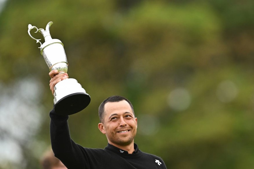 Xander Schauffele raises the claret jug after his Open win at Royal Troon