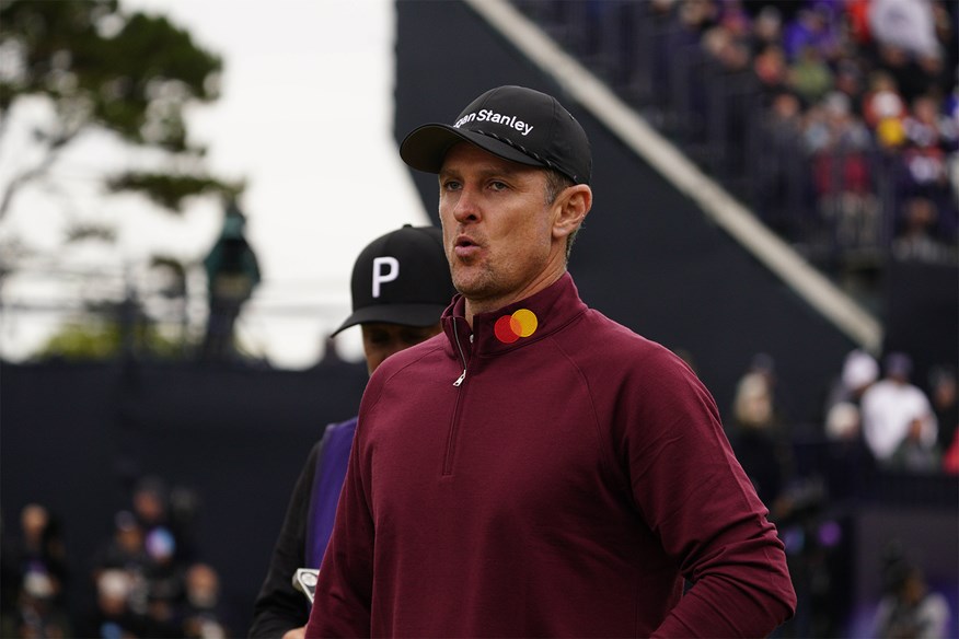 Justin Rose puffs out his cheeks during the final round at The Open.