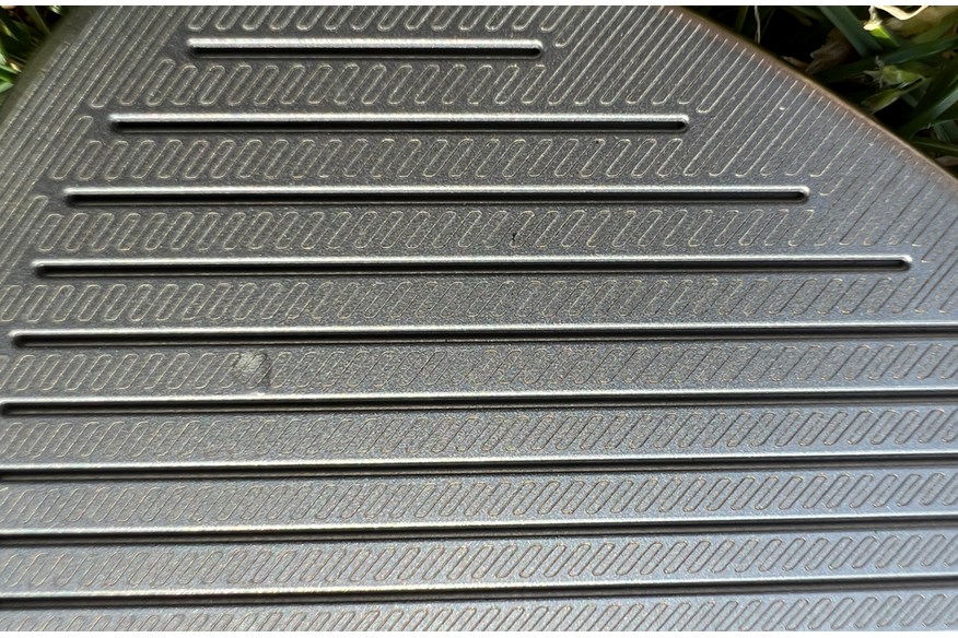 A close up of the laser etched Spin Tread grooves on the TaylorMade Hi-Toe 4 wedge. 