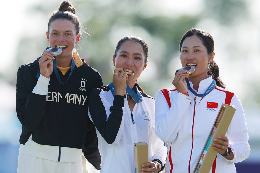 Olympic golf medalists Lydia Ko (center), Esther Henseleit (left), and Lin Xiyu.