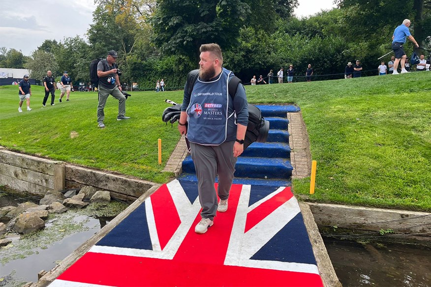 Lewis walks over the Union Jack on the signature 10th hole