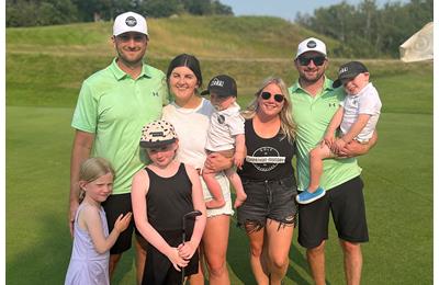 Dylan Thornborough and Patrick Law celebrated with their families after breaking the world record for the most holes of golf played in 12 hours.