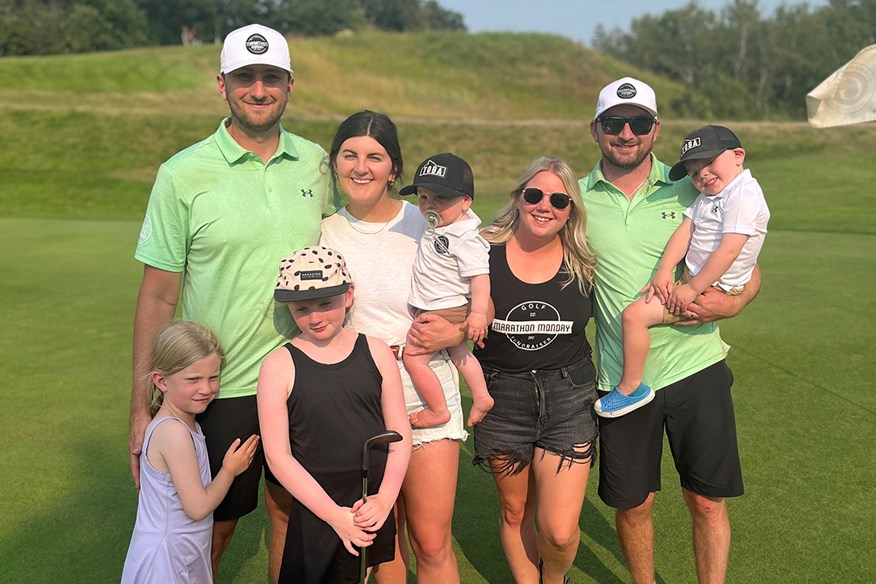 Dylan Thornborough and Patrick Law celebrated with their families after breaking the world record for the most holes of golf played in 12 hours.