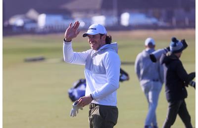 Welsh former footballer Gareth Bale waves on the fairway of the first hole of the Old Course, St Andrews