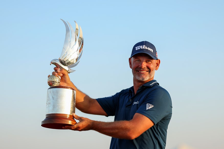 Paul Waring of England poses with the trophy on the 18th green on day four of the Abu Dhabi HSBC Championship 2024 at Yas Links Golf Course