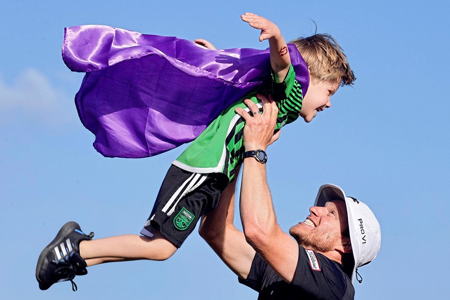 Peter Malnati celebrating with his son, Hatcher.