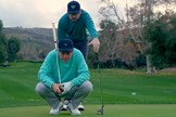 Sean Toulon and his Son, Preston, line up a putt with their new 2024 First Run Toulon Golf putter collection