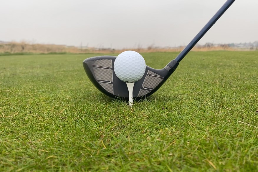 Wilson Dynapower Carbon driver addressing the golf ball view of the club face