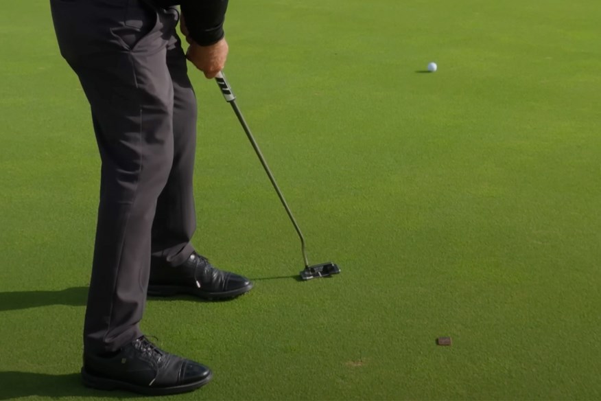 This major-winning golfer explains why he takes divots with his putter.