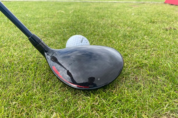 Wilson Dynapower Carbon fairway wood addressing the ball view from behind