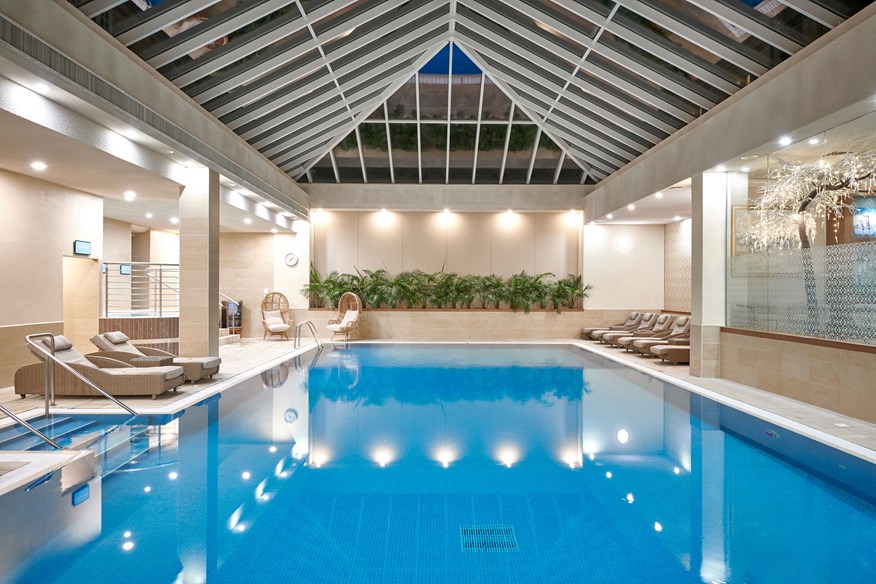 The glass-roofed pavilion pool is one of several impressive features housed within Matfen Hall's spa.