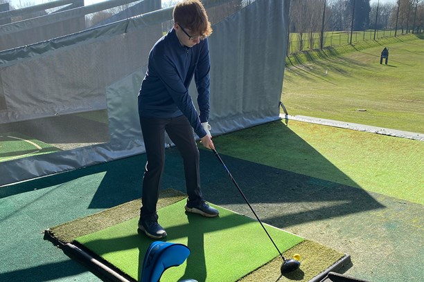 Cameron Adam using the Strata Package Set on the driving range