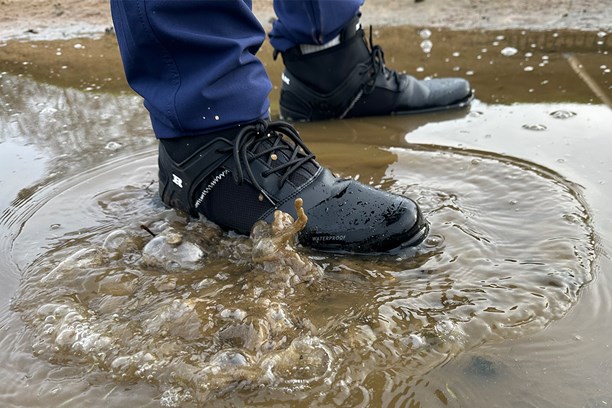 Ram FX winter boot submerged in water on the course