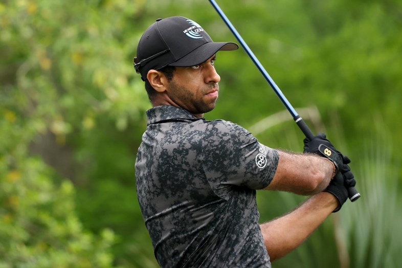 Why does golfer Aaron Rai wear 2 gloves and uses iron covers?