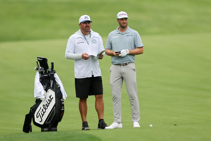 Wyndham Clark uses a black and white Titleist bag like that seen in the Oakmont locker room photo.