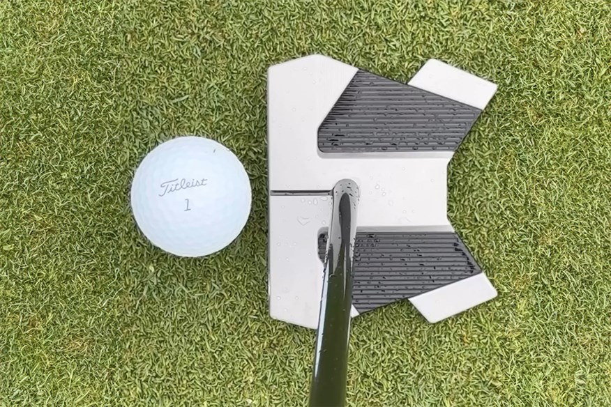 Scotty Cameron T-11 at address.