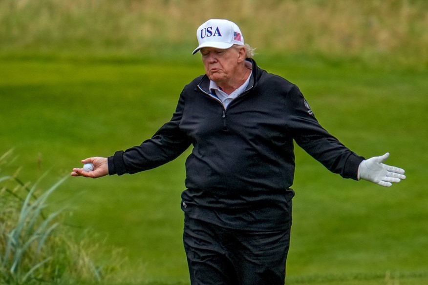 Donald Trump's Turnberry caddie was caught helping him on the Scottish links.