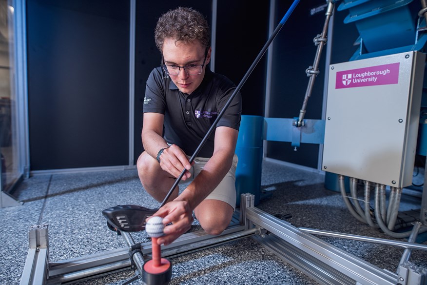 James Morris sets up another golf ball to be hit by the driver for the 2025 robot golf balls test.