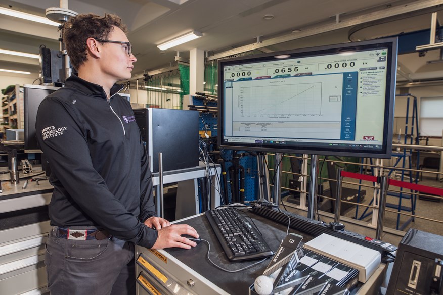 James Morris captures the compression data during the Today's Golfer 2025 golf balls robot test at Loughborough University.