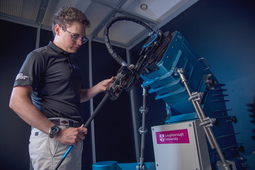 James Morris prepares the robot to hit driver shots as part of our 2025 golf balls test at Loughborough University.