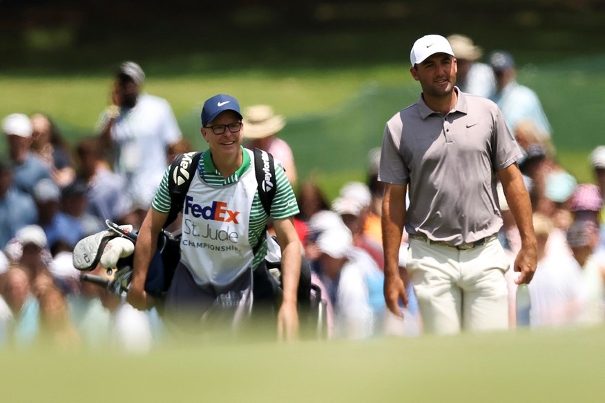 Scottie Scheffler turns to stand-in caddie Brad Payne when Ted Scott is unavailable.