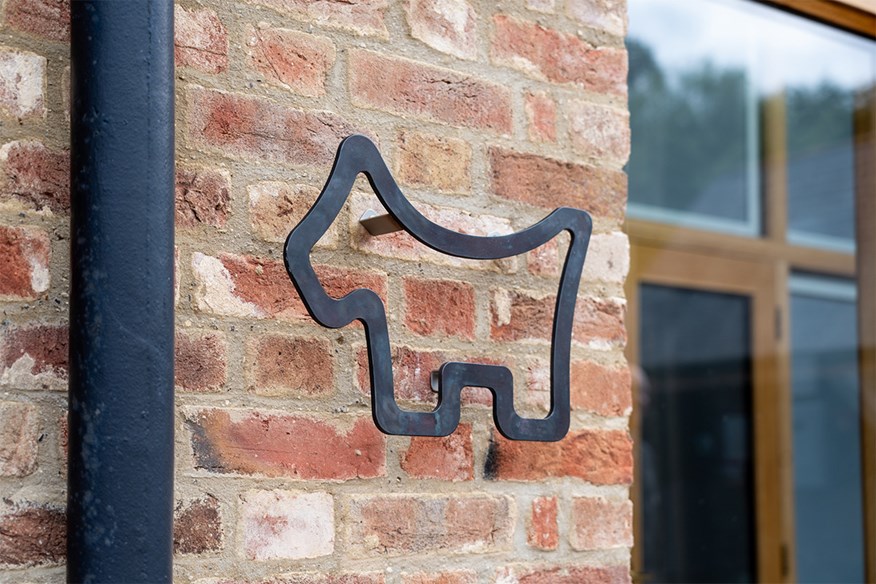 The Scotty Cameron facility 'The Barn' is only identifiable by the Scotty Dog logo on the exterior