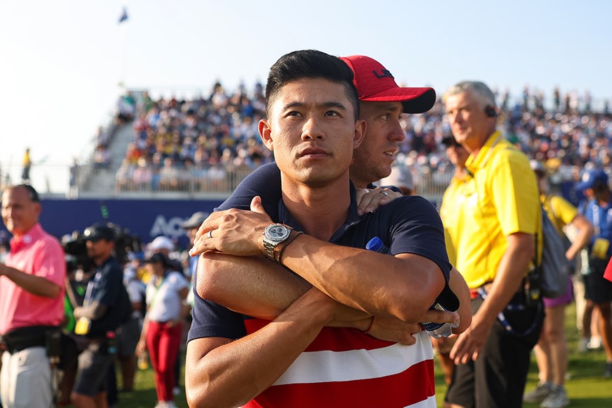 Collin Morikawa and Justin Thomas share an embrace after the USA's defeat in Rome.