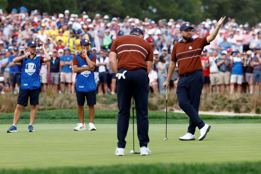 Shane Lowry tries to calm fans so Rory McIlroy can putt on the 6th hole at Bethpage.