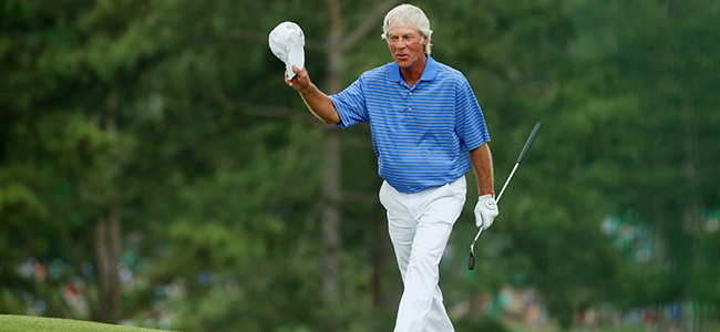 Ben Crenshaw tips his hat to the crowd after finishing his round at The Masters