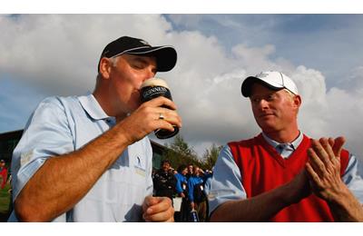 A spectator drinking a pint at a golf tournament.