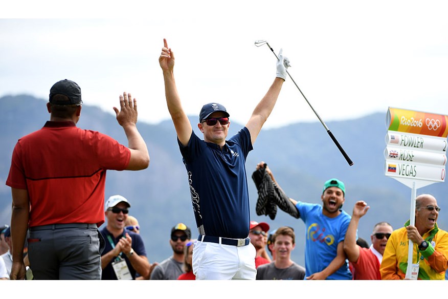  Justin Rose of Great Britain celebrates his hole-in-one on the par four 4th hole during the first round of men's golf on Day 6 of the Rio 2016 Olympics