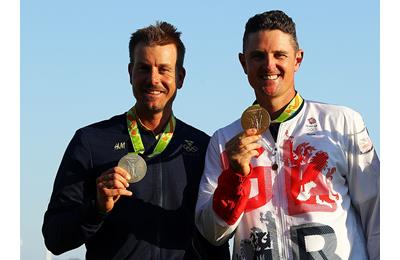 Justin Rose (R) of Great Britain celebrates with the gold medal and Henrik Stenson (L) of Sweden, silver medal, after the final round of men's golf on Day 9 of the Rio 2016 Olympic Games