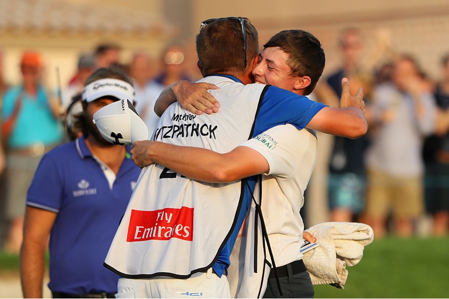 Matt Fitzpatrick celebrates holing the winning putt on the 18th green with his caddie Jamie Lane