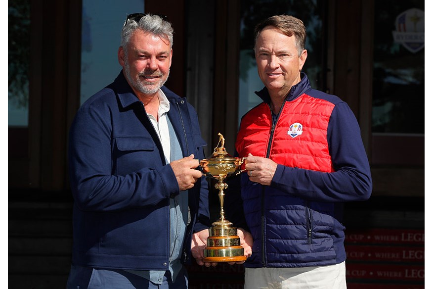 Team captains Darren Clarke and Davis Love III pose with the Ryder Cup Trophy prior to the 2016 Ryder Cup at Hazeltine National