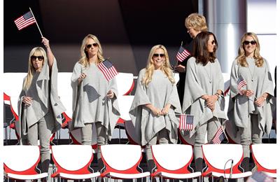  Justine Reed, Nichole Moore, Amy Mickelson, Sybi Kuchar and Becky Edwards wave flags during the 2016 Ryder Cup Opening Ceremony at Hazeltine