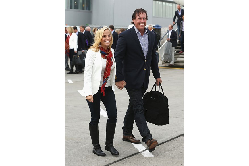 Phil Mickelson of the United States and wife Amy Mickelson arrive at Edinburgh Airport