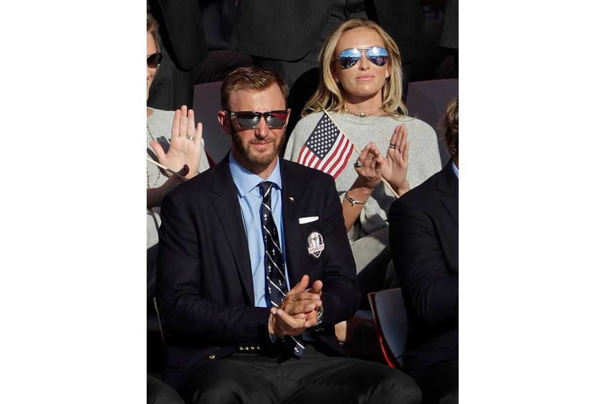 Dustin Johnson of the United States sits with Paulina Gretzky during the 2016 Ryder Cup Opening Ceremony at Hazeltine National