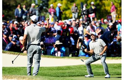 Rafa Cabrera Bello and Sergio Garcia of Europe react to a putt on the 17th green during morning foursome matches of the 2016 Ryder Cup at Hazeltine National