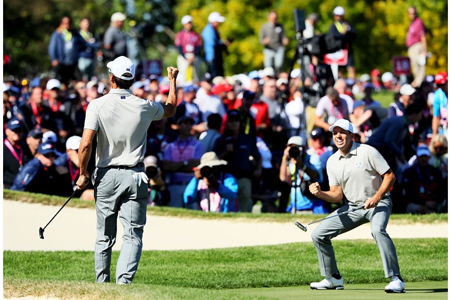 Rafa Cabrera Bello and Sergio Garcia of Europe react to a putt on the 17th green during morning foursome matches of the 2016 Ryder Cup at Hazeltine National