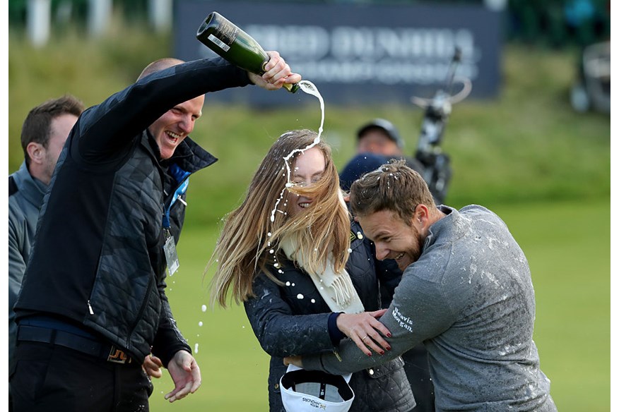 Tyrrell Hatton celebrates winning the Dunhill Links